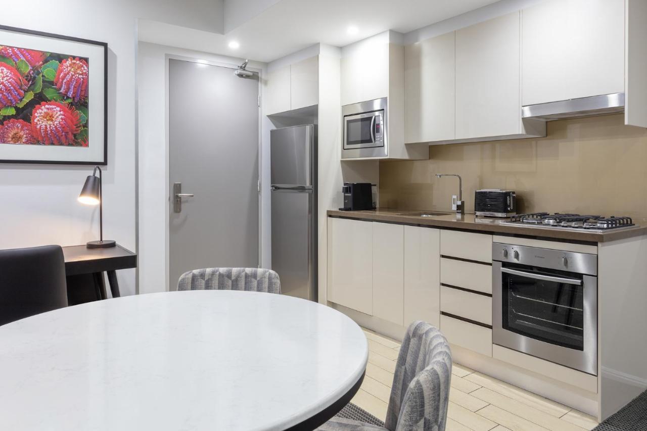 Meriton Suites North Ryde Sydney Exterior photo A typical kitchen in a serviced apartment