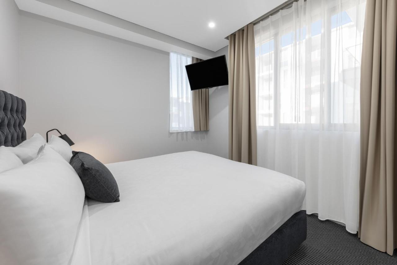 Meriton Suites North Ryde Sydney Exterior photo A bedroom at the hotel