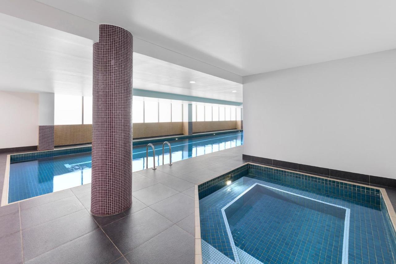 Meriton Suites North Ryde Sydney Exterior photo The swimming pool at the hotel