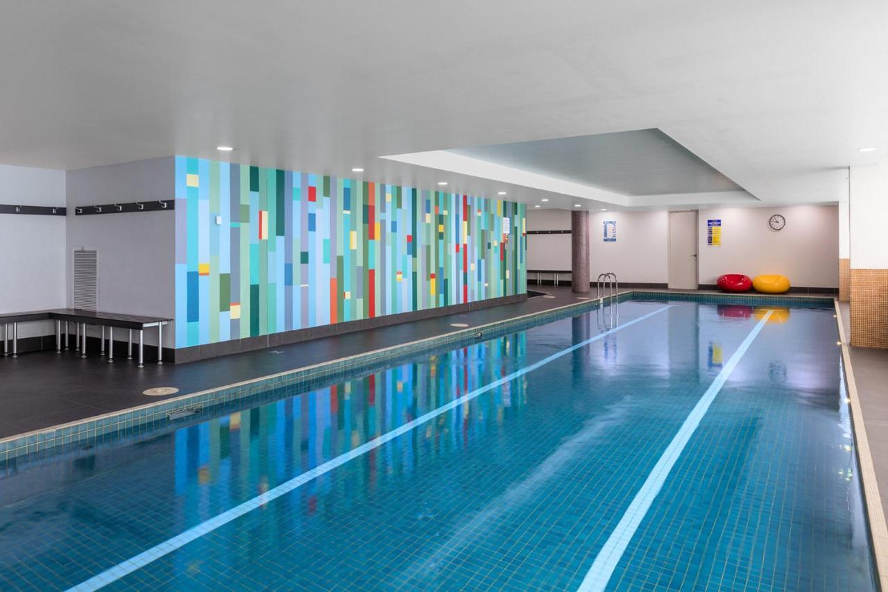 Meriton Suites North Ryde Sydney Exterior photo The swimming pool at the hotel